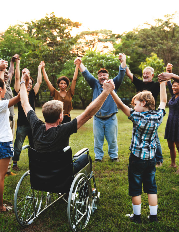  Group of people holding hand together in the park